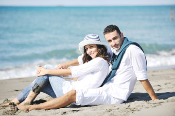 Fototapeta premium happy young couple have fun at beautiful beach