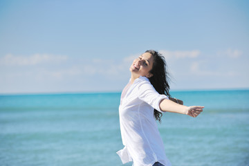 Fototapeta na wymiar happy young woman on beach