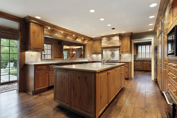 Fototapeta premium Tradiitional kitchen with oak wood cabinetry