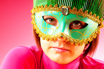 Attractive woman posing in the stylish mask