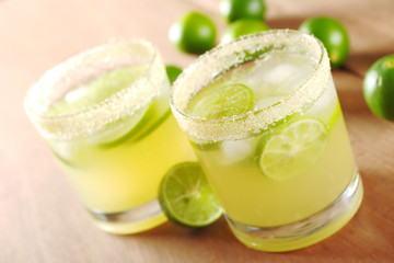 Fresh lemonade with lime slices and ice cubes