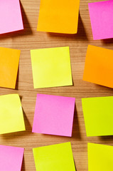 Many reminder notes on the wooden background