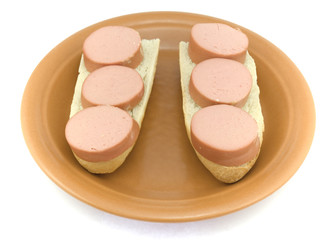 Two sandwiches with sausage