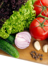 Fresh vegetables on wooden hardboard