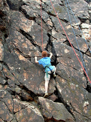 boy climbing on rope
