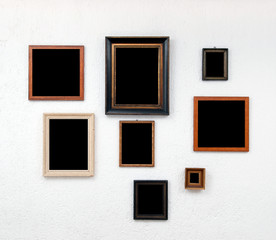 Picture frames on textured white wall