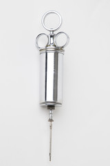 Metal syringe