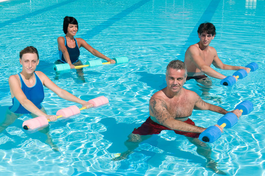 Fitness exercising in swimming pool