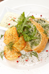 fish pie with sauce and potato chips