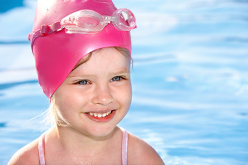 Child swimming in pool.