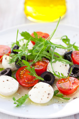 salad with mozzarella, tomatoes and black olive