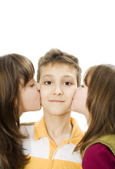 Two little girls kissing boys, studio shoot