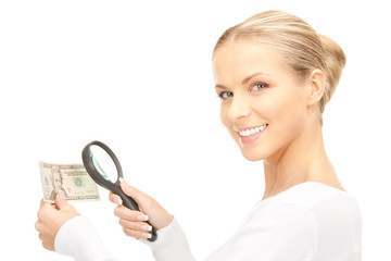 woman with magnifying glass and money