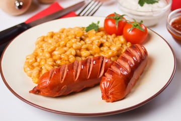 Fried sausages with white beans
