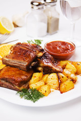 Barbecued ribs with baked potato