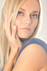 Naklejka premium Charming woman holding her cheek