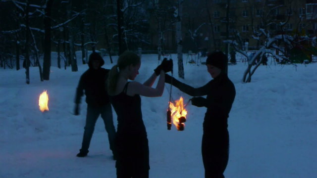 Fire show - tricks with burning poi