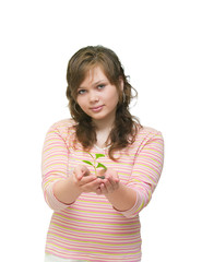 Closeup portrait of a beautiful happy young woman holding plant