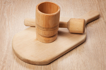 mortar and breadboard on the wooden table