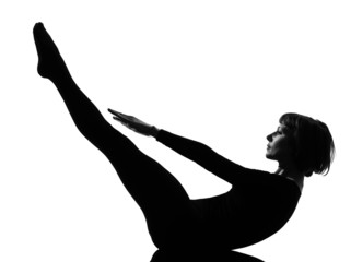 Fototapeta premium woman paripurna navasana boat pose yoga