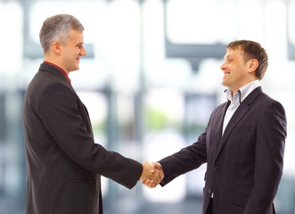 business people shaking hands over a deal