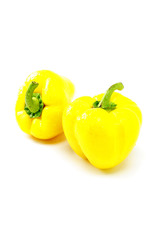 Two wet yellow pepper