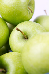 Green apples on white background