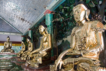 Fototapeta premium Golden Buddha statues in Shwedagon Pagoda,Yangon