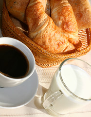 breakfast with coffee, milk and pastry