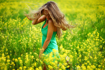 woman on oilseed field