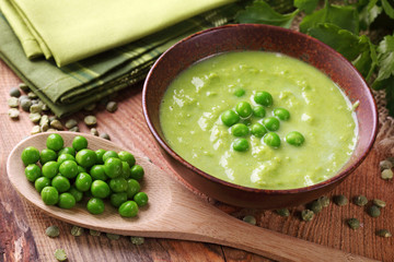 Green pea soup in bowl © Elena Schweitzer