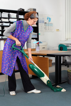 professional cleaning lady at her work in the office