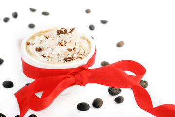 cup of coffee with cream and red bow