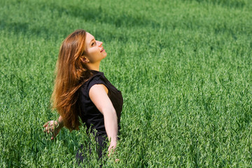 Happy young woman relaxing on nature
