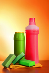 assorted cleaning products on  yellow background