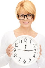 woman holding big clock