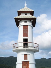 Thai lighthouse tower with blue sky cloud