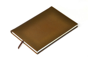 Light brown leather notebook on white background