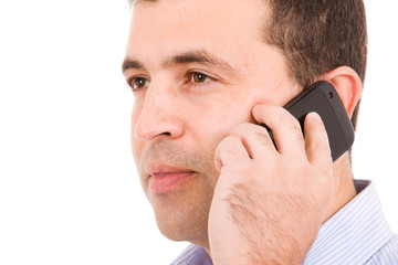 Close-up portrait of a young casual man on the phone. Isolated o