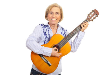 Smiling aged woman with acoustic guitar