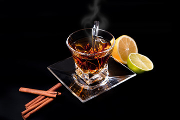 Cup of tea on black background