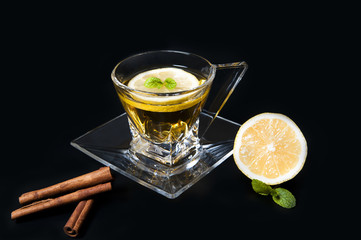Cup of tea on black background