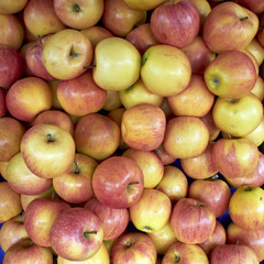 juicy apples at the local market, natural background