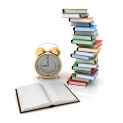 alarm clock near stack of books over white