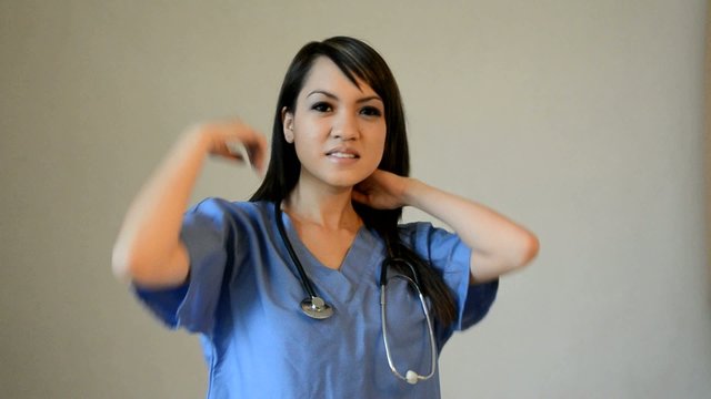 Nurse putting on stethoscope
