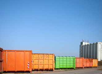 Colorful container for waste transport on an industrial site