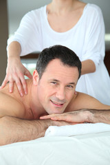 Obraz na płótnie Canvas Handsome man having a massage