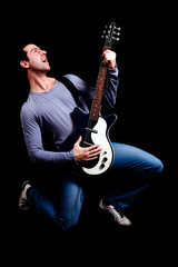 Fototapeta premium Crazy guitarist isolated on black