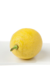 Lemon Closeup in High Key on White Plate