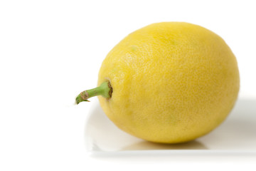 Lemon Closeup in High Key on White Plate